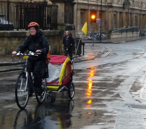 Smiling through the rain. Cycling in the rain is really not as bad as it 