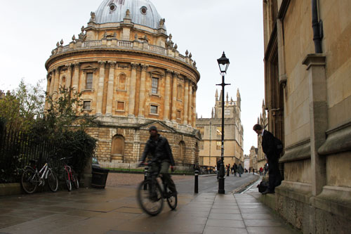 Cycling past Radcliffe Camera